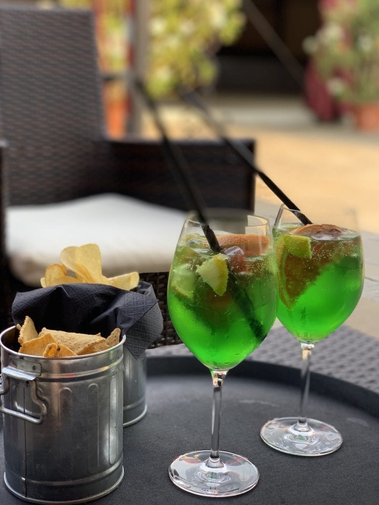 the unique green spritz discovered during our castel brando staycation in the northern italy last summer
