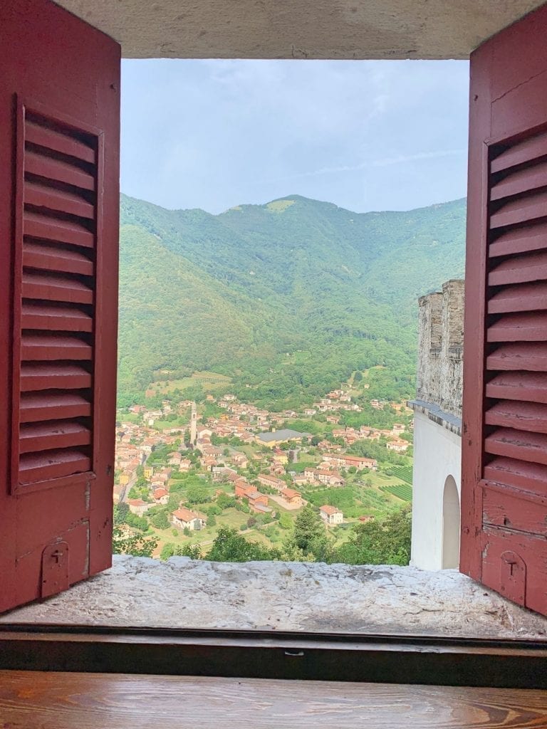 the beautiful view in the morning from the little medieval style windows in our hotel room in castel brando