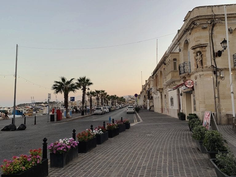 the peaceful fish town in malta near sunset hours