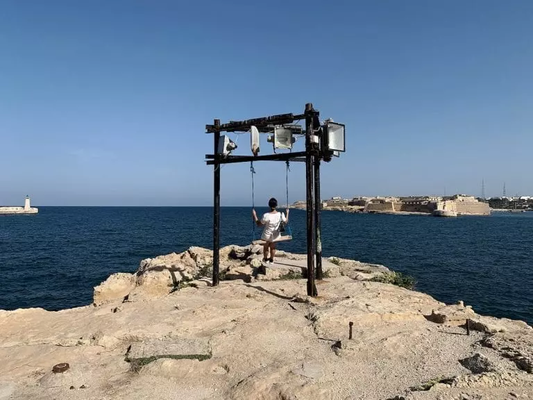 the unexpected crafted swing facing to the open blue sea directly near fort.st.elmo