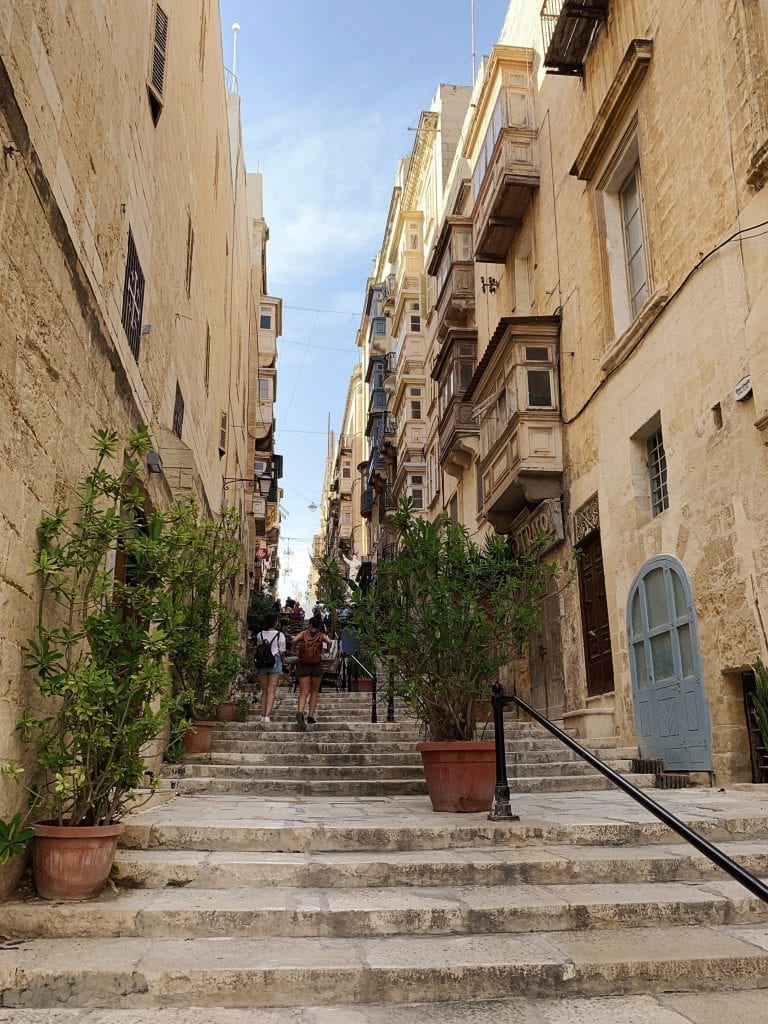 the stairs and the white color buildings are so classic in valletta old city center