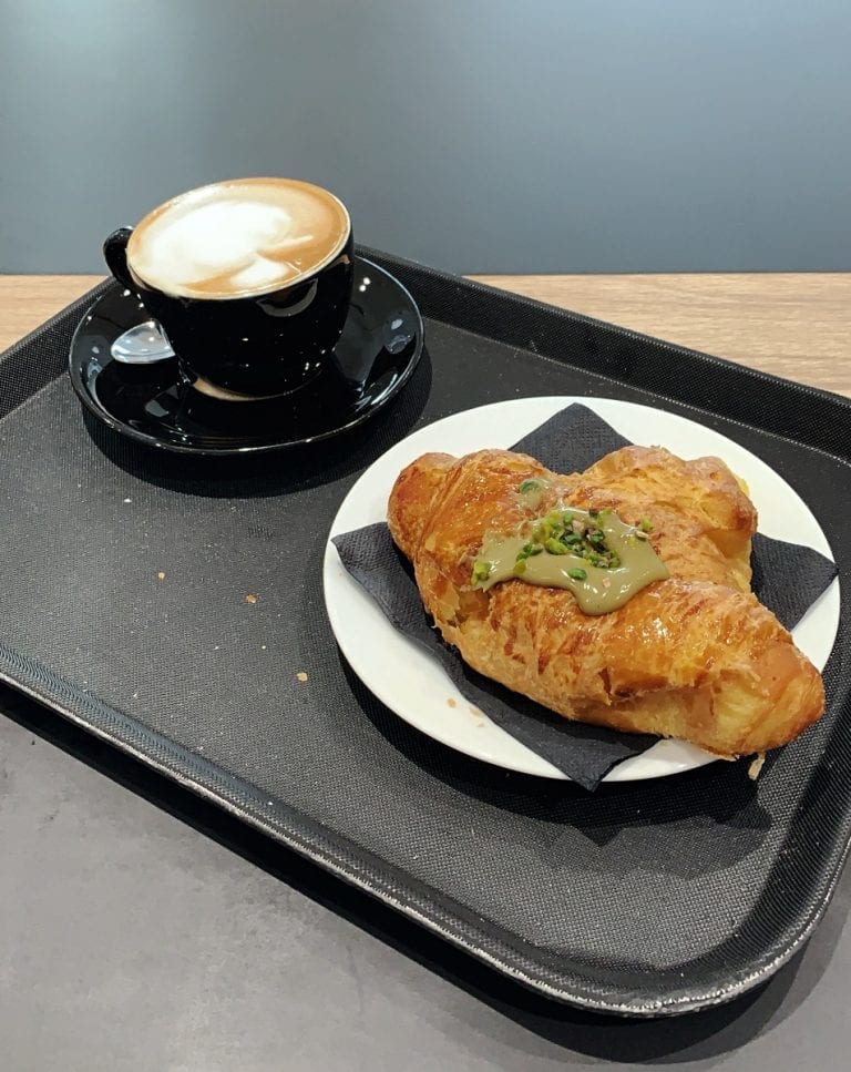 artisan croissant with yummy but not too sweet pistacchio cream inside and a cup of cappuccino is the normal breakfast in rome