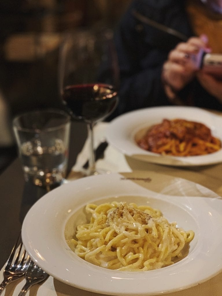 the yummy carbonara and amatricciana pasta from matriccianella restaurant in rome city center