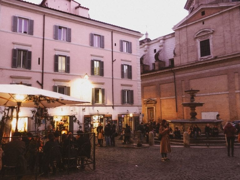 the purple sunset in the busiest square of cavour and the night life starts from there