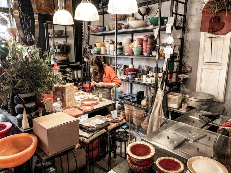 the girl is working on handmade candles in candle story roma