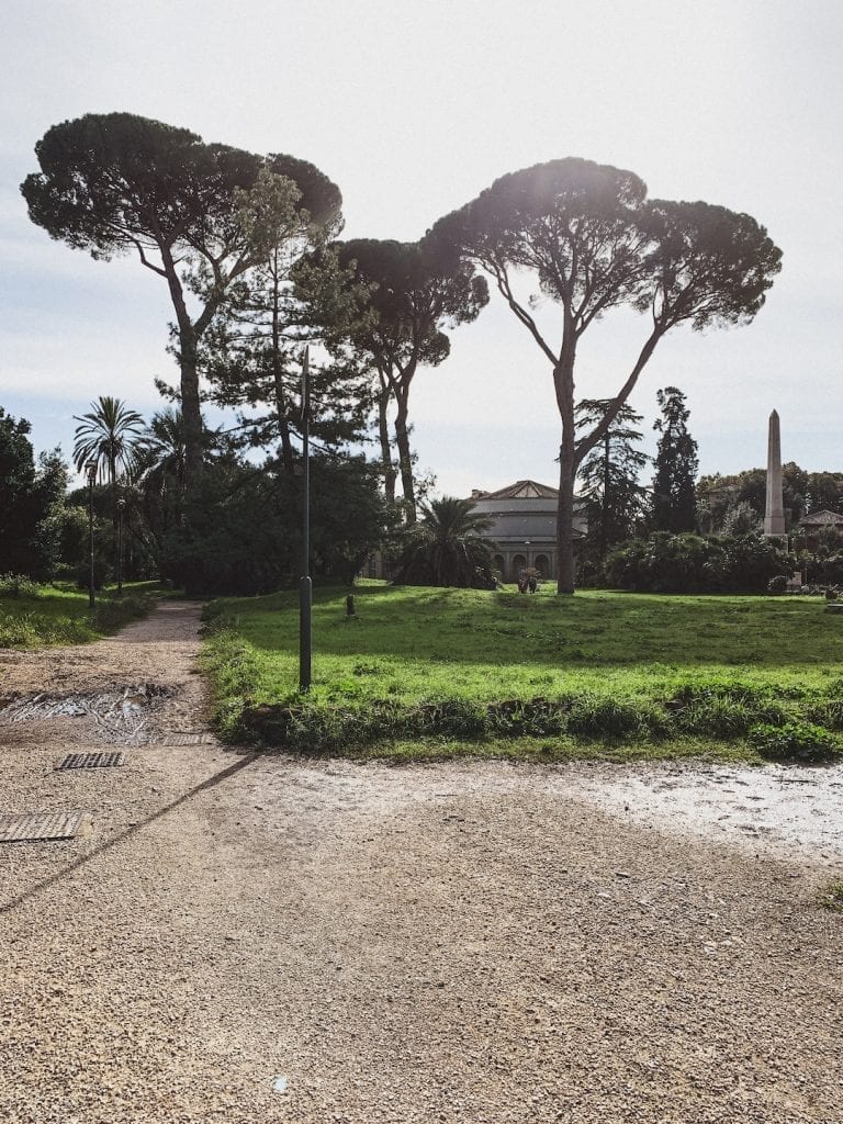 the large villa torlonia in the summer is the best place for people to walk around and enjoy the outdoor vibe