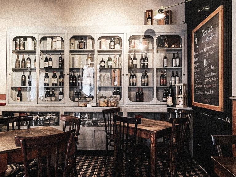 the cozy and casual bistro civico 4 in cavour with a wall of fine wines