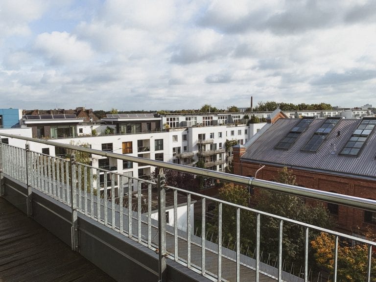 the big and connected balcony of our hotel room is able to let us enjoy the quiet hamburg neighborhood