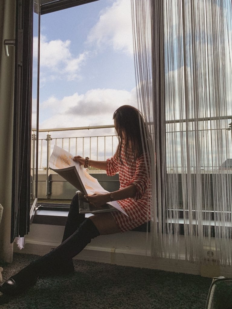 25hours hotel balcony is perfect for sitting and enjoy the good weather while reading their internal newspaper for local information