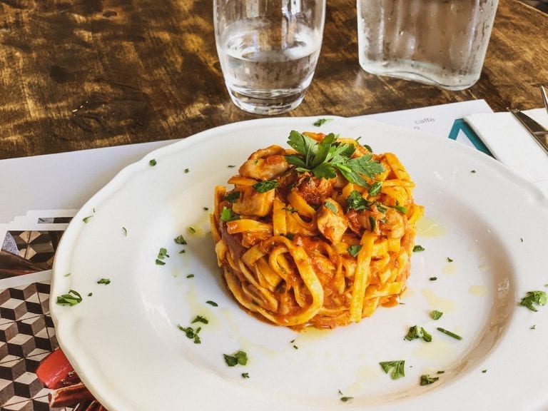 tagliatelle with ragu of octopus and tomato sauce by civico 4 in cavour neighborhood in rome is the best simple seafood pasta dish