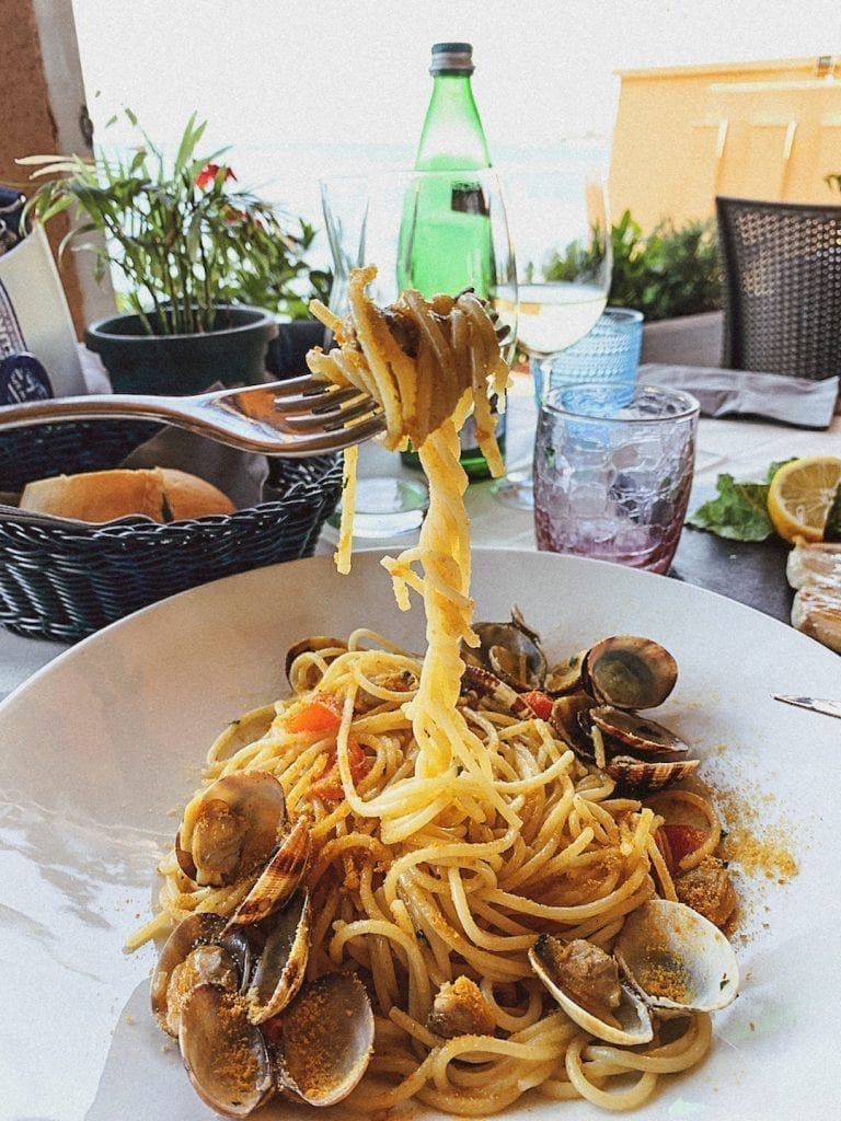 a beautiful pasta dish based on seafood and originally from Naples is spaghetti with vongole which means with clams