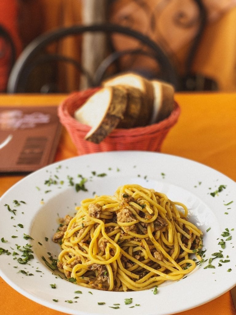 tonnarelli pasta with ragu of minced rabbit meat and porcini mushroom is an earthy but simple pasta dish by gli angeletti restaurant in cavour neighborhood in rome