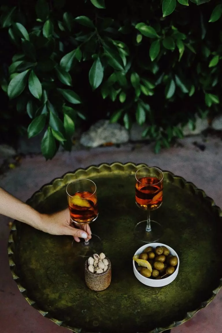 typical italian aperitivo is always going with a glass of classic italian cocktail like negroni or spritz