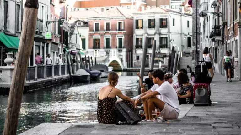 people like to grab a classic italian cocktail spritz near sunset hours and drink with friends outside or in the street in italy