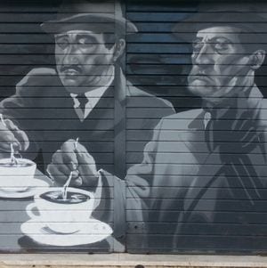graffiti of two Italian men drinking cappuccino in a bar