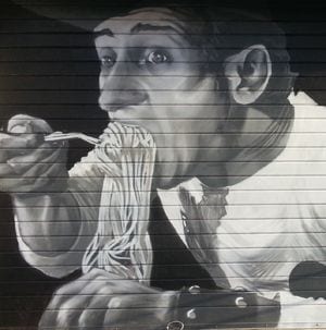 rome street art on shop roller shutter for the famous italian old movie un americano a roma