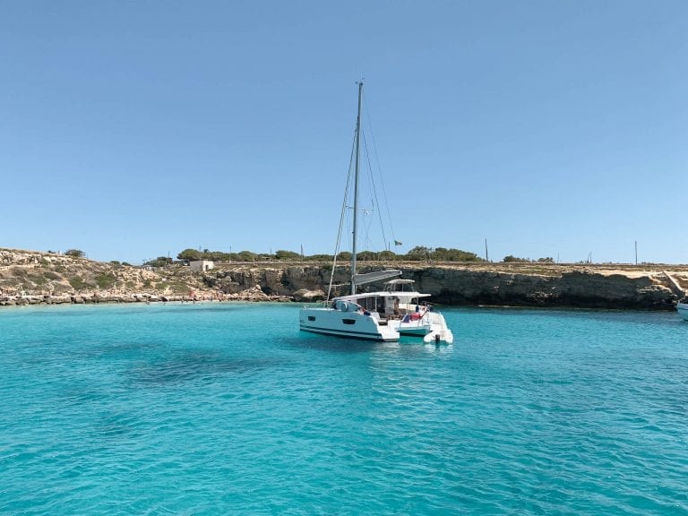 take a sailing boat from Trapani for the island hopping and you cannot miss the endless blue lagoon near Favignana and Levanzo islands