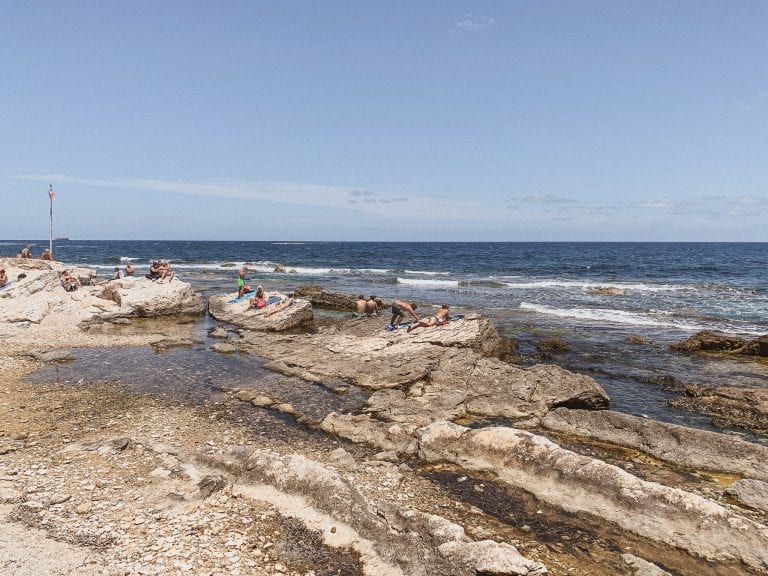 The locals prefer rocks than sands for the all day sun bath in Trapani