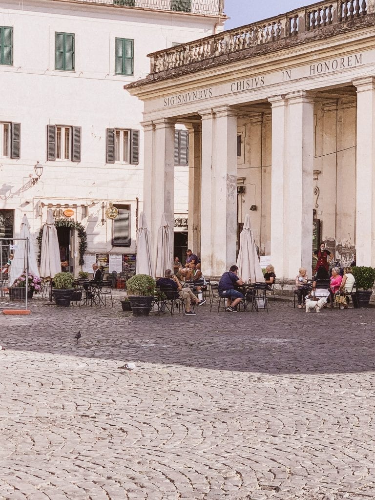 People chilling with coffee espresso and waiting for a fresher night to arrive in Ariccia during the late afternoon hours