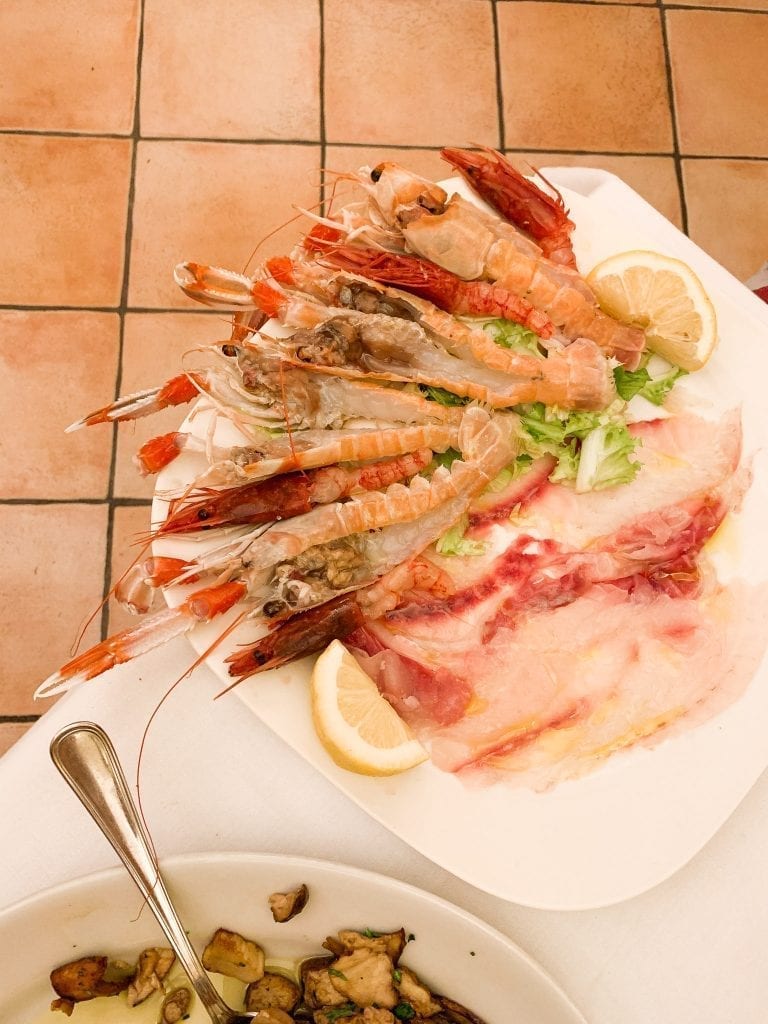 Savor a huge platter of super fresh raw seafood platter by Trattoria da Teo in Trastever is our recent favorite thing to do