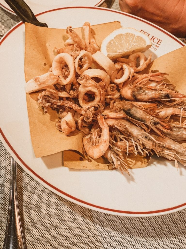 Where to eat in Rome September list, Felice a Testaccio is the most famous restaurant for authentic Roman cuisine and who can say no to a perfect deep fried mixed seafood in the summer