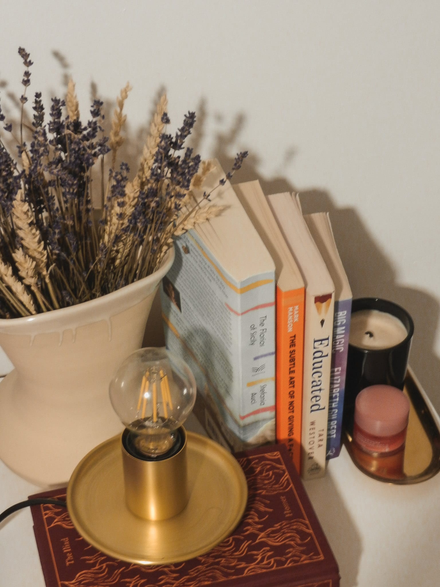 a snap of my bedside table with some books and some essentials for the night
