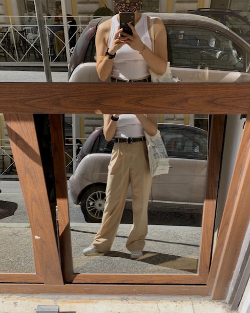 white and beige basic tank top and pleated trousers are a part of the wardrobe basic checklist for this spring and summer